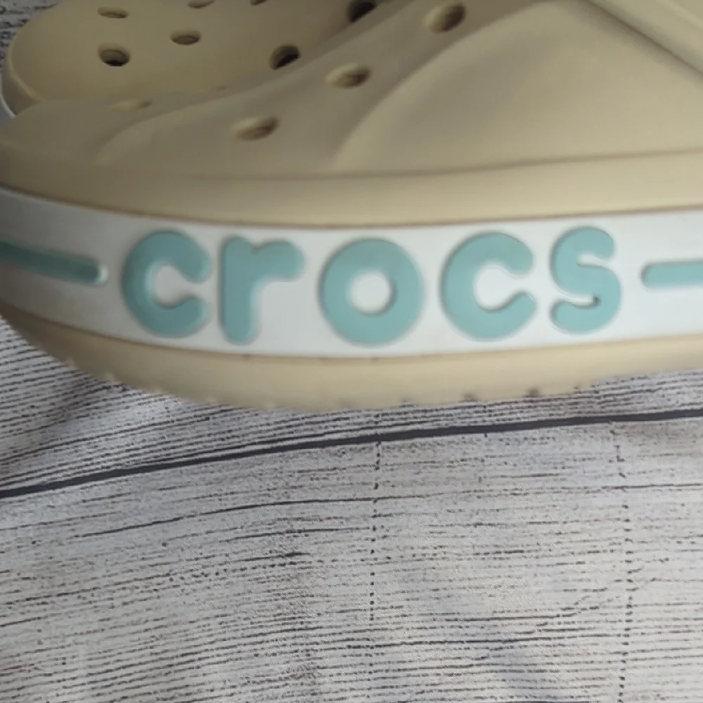 CROCS Kids Classic Clog in Cream with Light Blue Trim